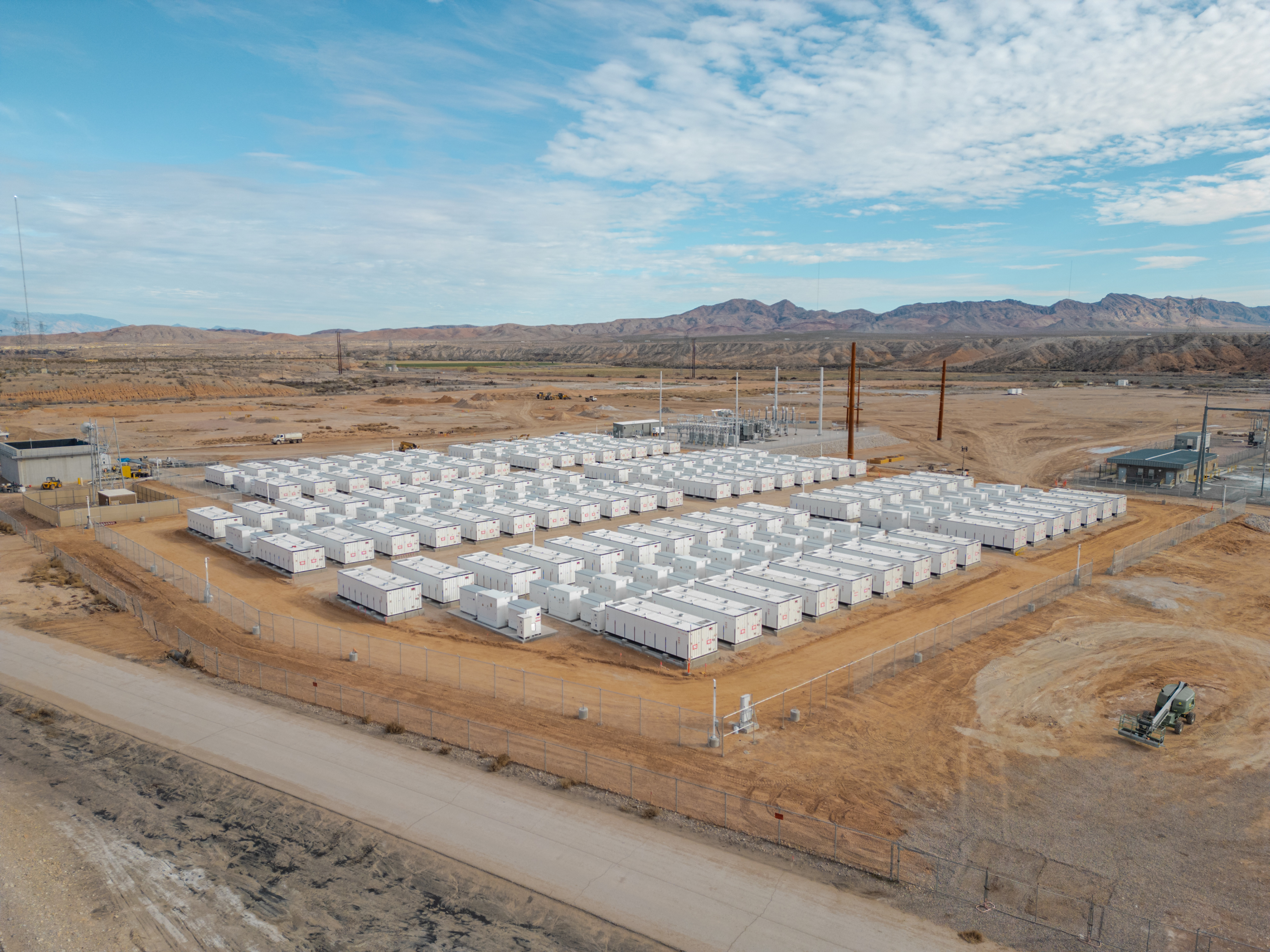 Rows of white battery energy storage containers at the Reid Gardner BESS project in the Nevada desert
