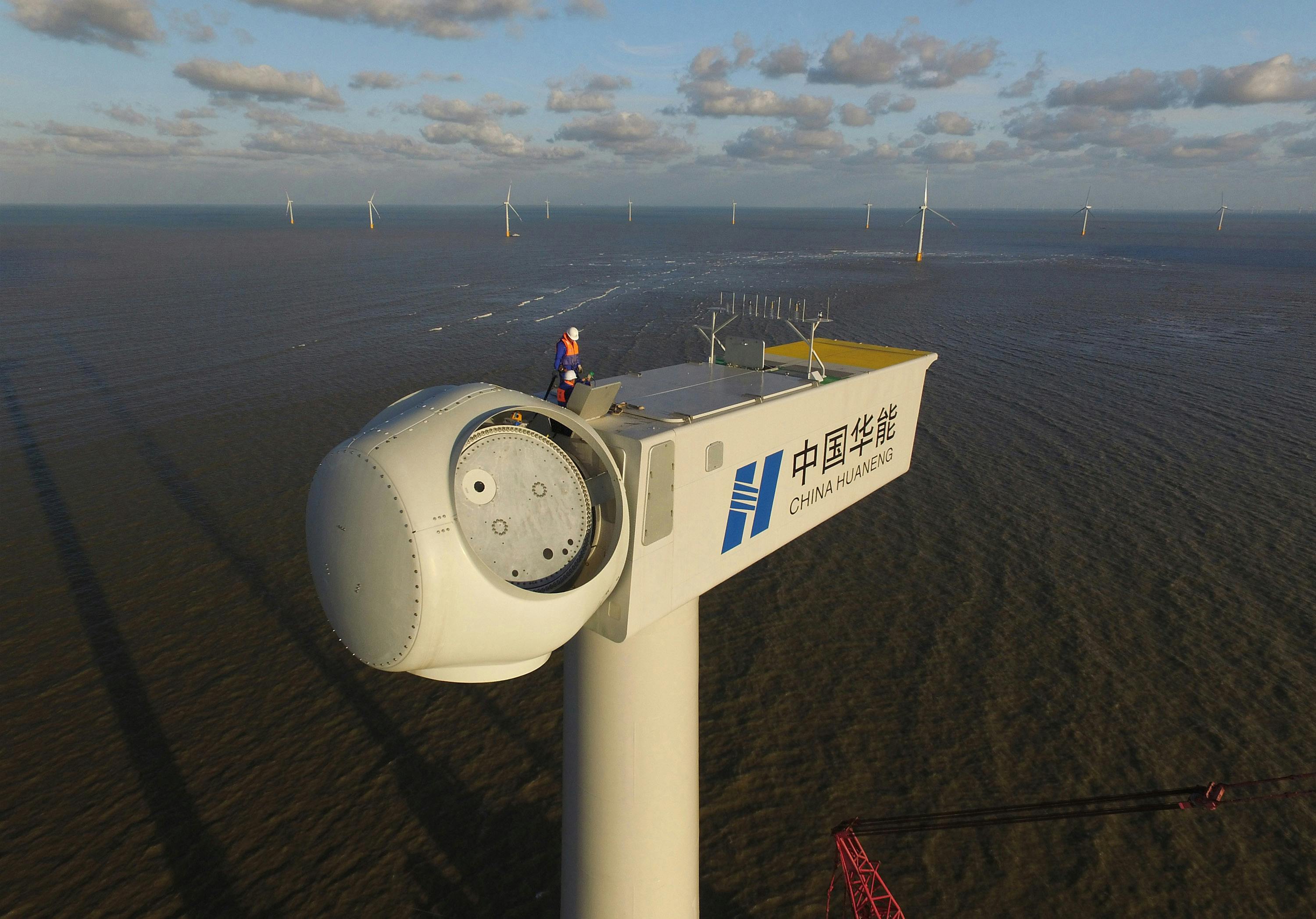 Engineer performing maintenance on an offshore wind turbine