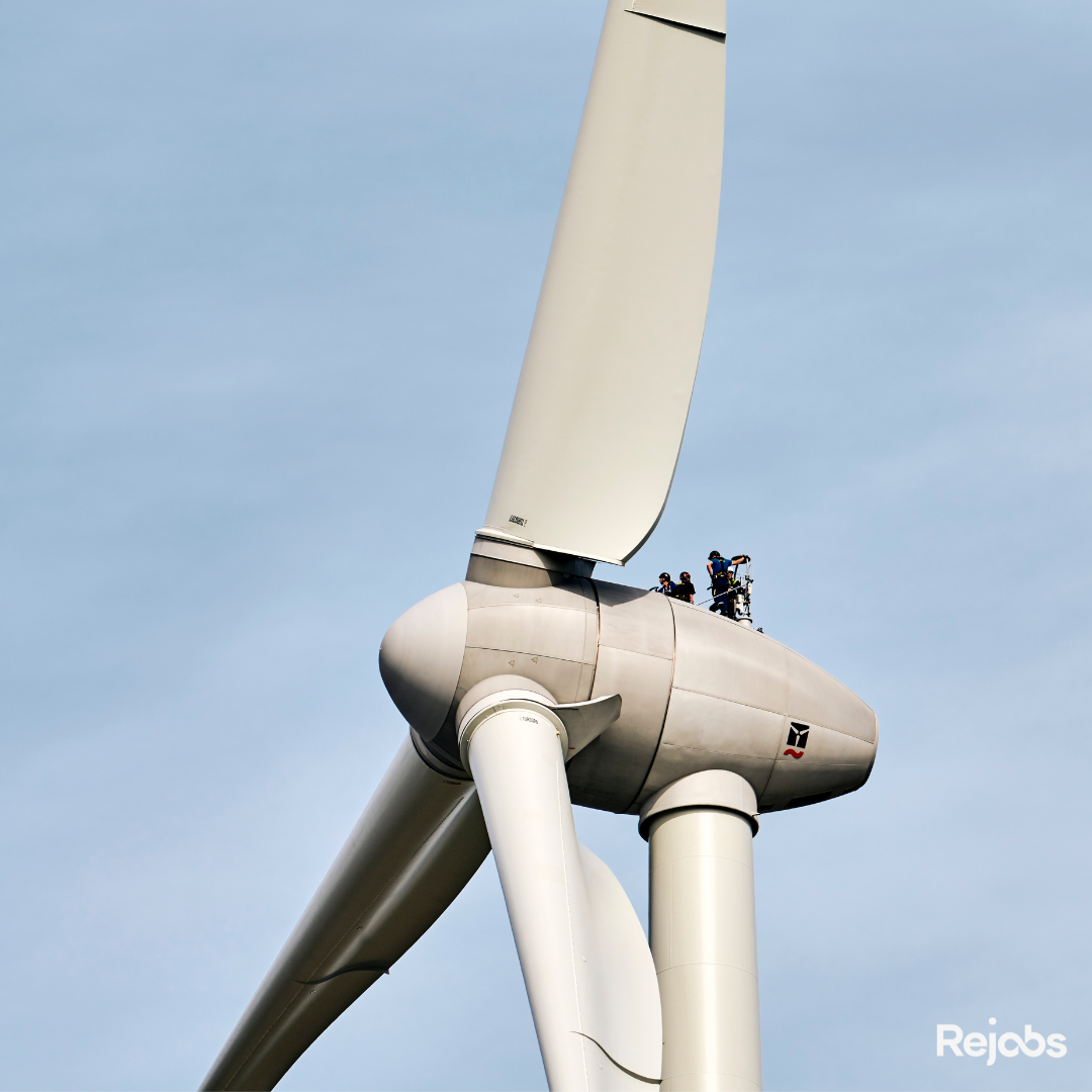 Workers servicing a wind turbine